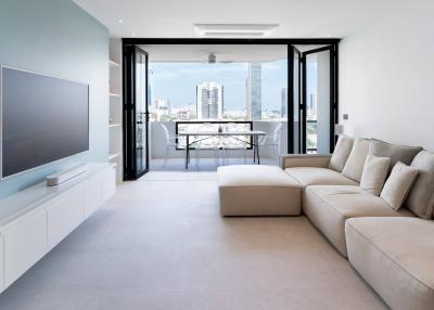 Modern living room with city view and balcony access