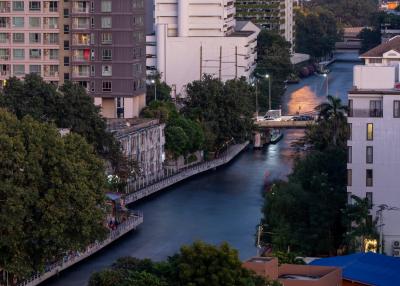 Urban canal view surrounded by apartment buildings at dusk