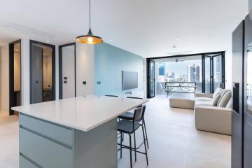 Modern kitchen with open floor plan and city view