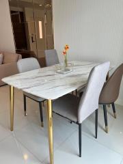 Modern dining area with marble table and chic furnishings