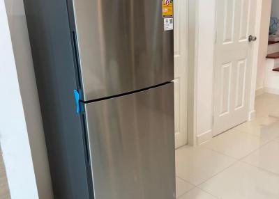 Stainless steel refrigerator in a modern kitchen setting