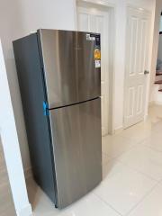 Stainless steel refrigerator in a modern kitchen setting