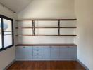 Minimalist bedroom with spacious shelving and modern storage cabinets