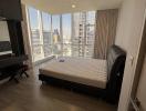 Spacious bedroom with city view and ample natural light