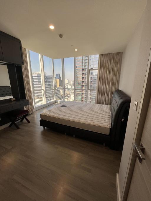 Spacious bedroom with city view and ample natural light