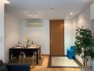 Modern dining room with set table and indoor plants