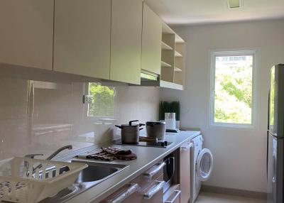 Modern kitchen with sleek cabinetry and stainless steel appliances