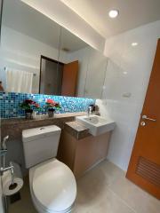 Modern bathroom with mosaic tile accent wall