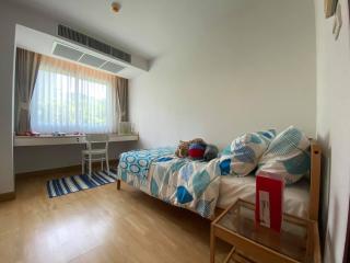 Cozy bedroom with large window and tasteful decor