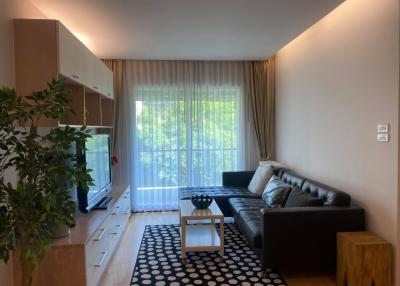 Modern living room with natural light and stylish furnishings