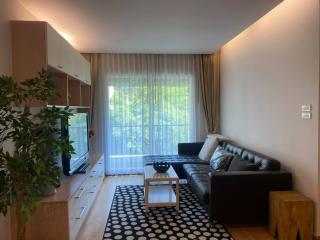 Modern living room with natural light and stylish furnishings