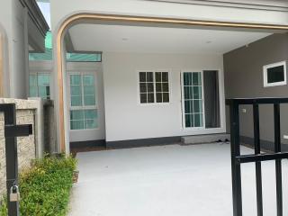 Exterior view of a modern house with a covered patio area