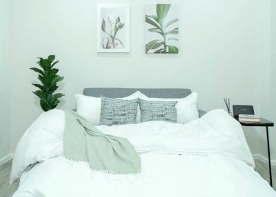 Cozy bedroom with clean design and decorative plants