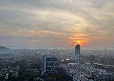 Sunset view over a cityscape showing residential and commercial buildings