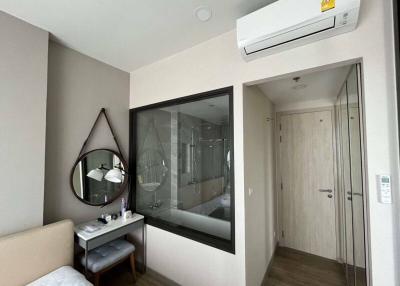 Modern bedroom interior with a view of the en-suite bathroom