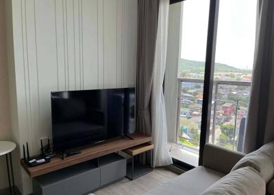 Modern living room with large window and city view