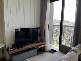 Modern living room with large window and city view