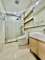 Modern bathroom with glass shower enclosure and vanity