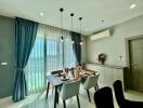 Modern dining room with stylish furnishings and abundant natural light.