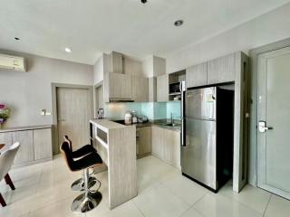 Modern kitchen with stainless steel appliances and breakfast bar