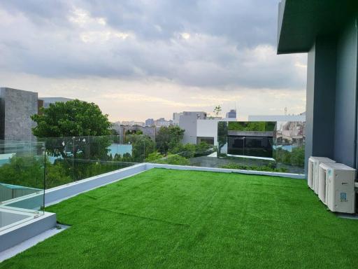 Modern rooftop garden with a view of the city skyline