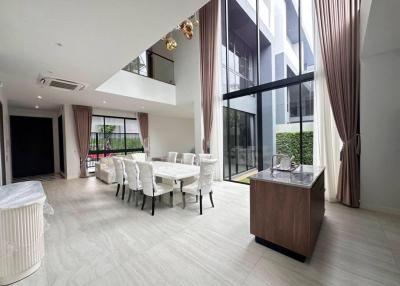 Spacious modern living and dining area with large windows