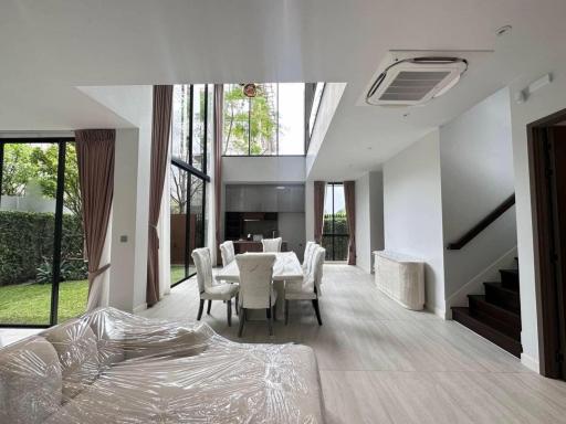 Spacious living room with dining area and ample natural light