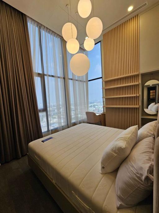 Contemporary bedroom with floor-to-ceiling windows and wooden paneling