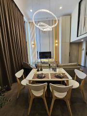 Modern dining area with stylish furniture and elegant lighting