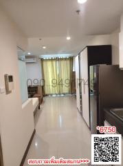 Modern apartment interior view showcasing the kitchen and living area with sleek finishes