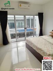 Bright and Spacious Bedroom with Large Window and Air Conditioning