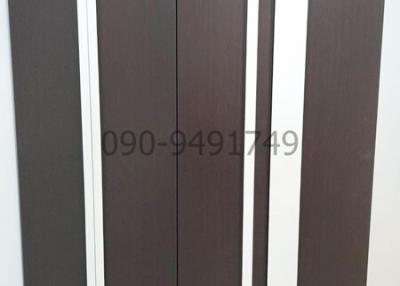 Wardrobe or closet doors with company branding and contact information
