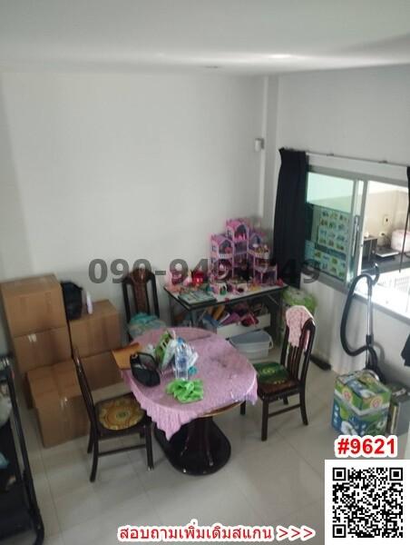 Dining room area with a table and chairs with personal items and packing boxes