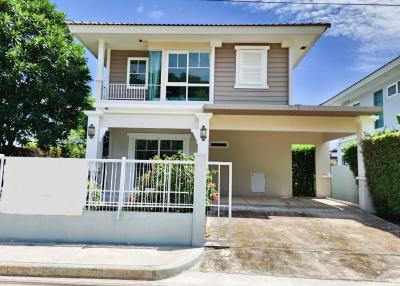 Two-story suburban house with blue sky