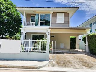 Two-story suburban house with blue sky