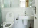 Modern white bathroom interior with toilet and sink