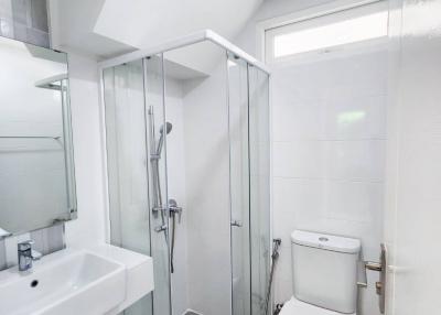 Modern bathroom with shower enclosure and toilet