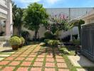 Well-manicured backyard garden with greenery and walkway