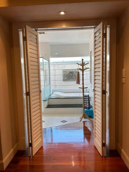 Elegant en-suite bathroom with glass shower and tiled floor