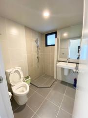 Modern bathroom with walk-in shower and large mirror