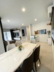 Modern kitchen interior with marble dining table and white decor