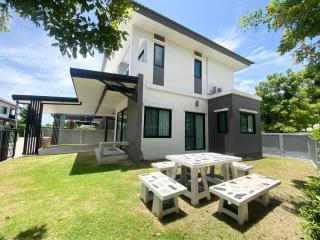 Modern two-story house with exterior lawn and patio