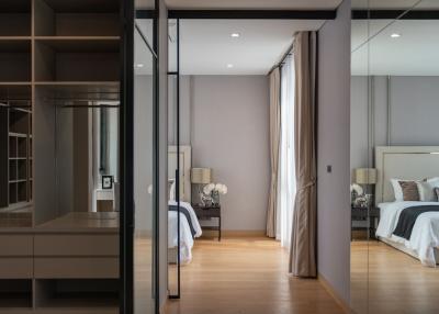 Modern bedroom with attached walk-in closet and en-suite bathroom