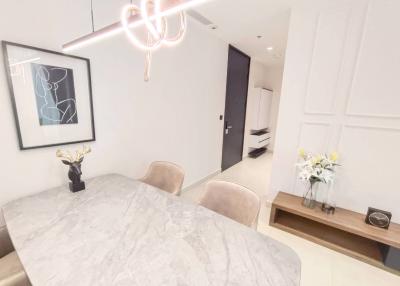 Modern dining room with marble table and elegant decor