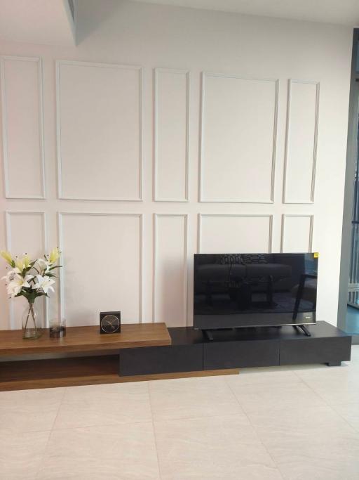 Modern living room with decorative wall panels and floating entertainment unit