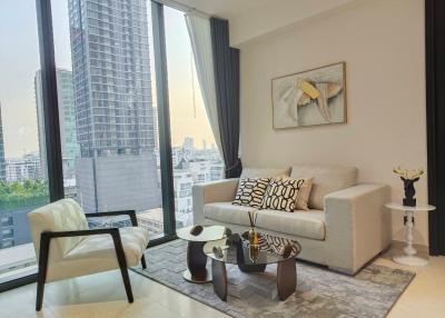 Modern living room with large window and city view