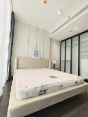 Modern bedroom with large window and elegant design