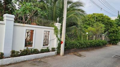 Exterior view of a residence with garden and fence