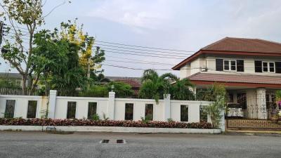 Spacious family home with landscaped front yard and a terracotta roof