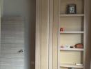 Spacious bedroom with built-in wardrobe and shelving unit